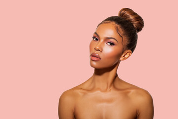 Beautiful Black Woman posing in studio on peach background. Fashion Portrait Black Woman, Makeup   ...