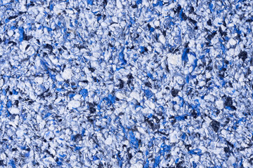 Abstract textured wallpaper. Decorative texture. Colored texture of liquid wallpaper to cover wall surface. Colored abstract background. Abstract texture of decorative plaster liquid wallpaper