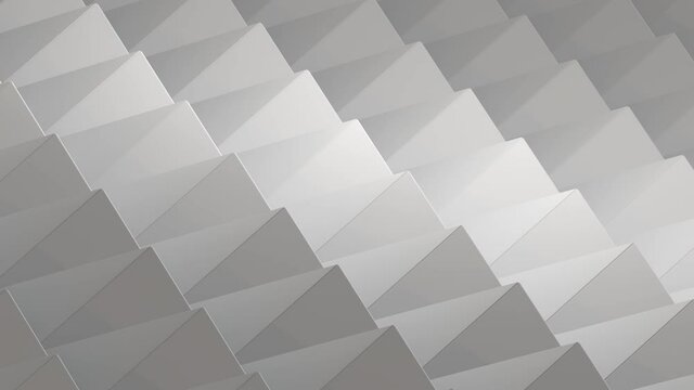 Seamless loop of grey and white triangles. Ideal for geometrical abstract text, title and logo background.
