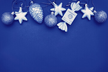 Christmas balls and toys on a blue background
