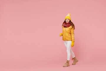 Full size body length exultant cheerful young woman 20s years old wears yellow jacket hat mittens...