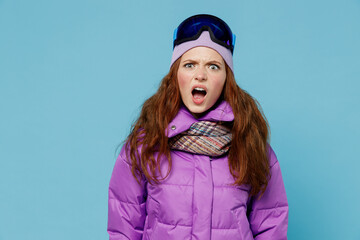 Skier sad angry woman in warm purple padded windbreaker jacket ski goggles mask spend extreme...