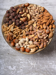 top view of assorted different types of nuts on a plate