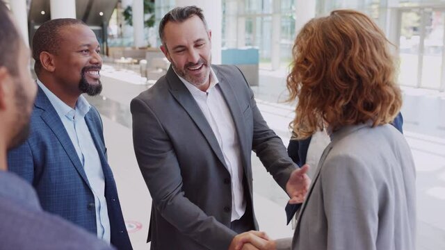 Business people shaking hands in meeting