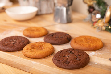 Home made giant cookies on wooden table with pieces of star anise and cinnamon