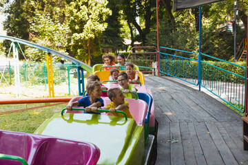 The confused kids ride a roller coasters for the first time