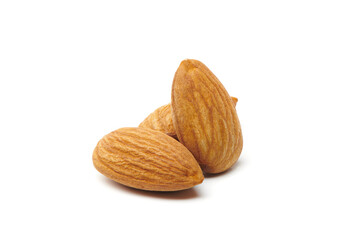 Group of almonds nuts isolated on white background. Nuts and seeds. Tasty and healthy organic snack. Almonds shelled nuts closeup view.