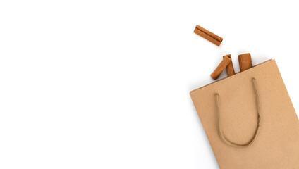 Cinnamon sticks in cardboard bag, healthy cooking ingredient, aroma spice