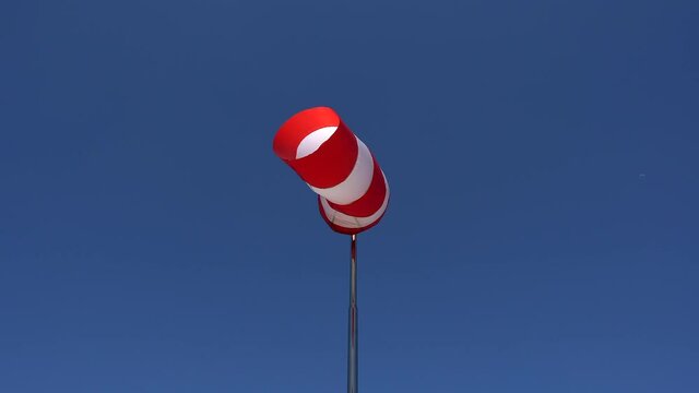 windsock Wind direction and intensity sign on helicopters and airfields. Wind cone used in aviation. Airport wind gauge.