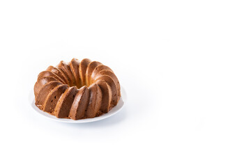 Traditional bundt cake with raisins isolated on white background. Copy space