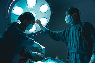 doctor team hard working in operating room attempt to save patient life tried and exhausted