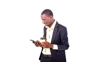 young business man holding coffee and chatting on mobile phone smiling.