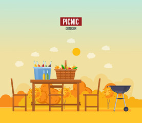Autumn outdoor picnic. Wooden furniture basket full of food drinks at fall scenery with inscription