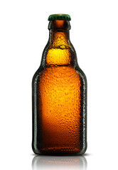 brown bottle with beer in drops