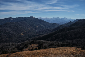 Silhouettes of mountains and dark forest in background. Wildlife untouched by man is beautiful. Beautiful view of mountain landscape and autumn valley in national park.