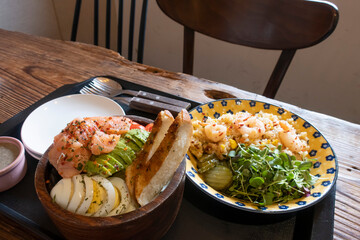 salmon salad, with mixed greens, avocado. Delicious healthy eating.