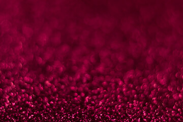 Pink sparkling glitter bokeh background, christmas abstract defocused texture. Holiday lights