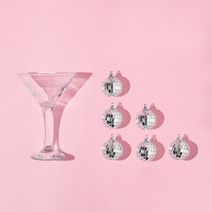 Christmas party creative layout with martini  cocktail glass  and disco ball decorations pattern on...