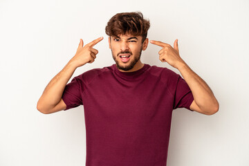 Young mixed race man isolated on grey background showing a disappointment gesture with forefinger.