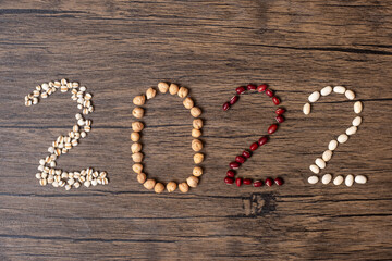 2022 New Year and New You with organic Beans; red,, white,, chickpeas and Adlay on table. Goals, Healthy, Motivation, Resolution, Weight loss, dieting and world food day concept
