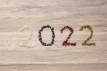 2022 New Year and New You with organic Beans; red, black, white, green and Adlay on table. Goals, Healthy, Motivation, Resolution, Weight loss, dieting and world food day concept