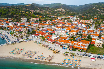 Fototapeta na wymiar Aerial view of typical greek village, beach, mountain. Nea Skioni, Halkidiki, Greece