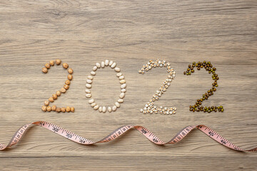 2022 New Year and New You with organic Beans; white, green, chickpeas and Adlay on table. Goals, Healthy, Motivation, Resolution, Weight loss, dieting and world food day concept