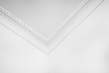 Detail of corner and ceiling cornice with intricate crown molding. © hiv360
