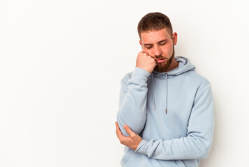 Young caucasian man with diastema isolated on white background who feels sad and pensive, looking at copy space.