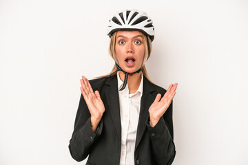 Young caucasian business woman wearing a bike helmet isolated on white background surprised and shocked.