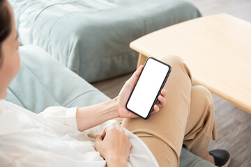 cell phone blank white screen mockup.hand holding texting using mobile on desk at office.background empty space for advertise.work people contact marketing business,technology