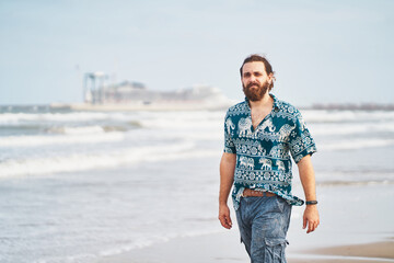 Calm man standing on shore near sea