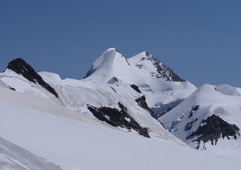 Panorama from Breithorn plateau with Lyskamm peaks in Switzerland