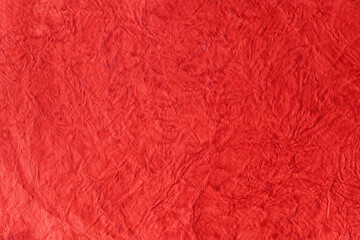 simple handmade red paper texture used as background high-resolution image. textured Christmas red paper used for decorative purpose wallpaper.