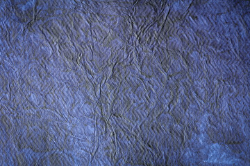 simple handmade paper texture used as background high-resolution image. textured dark blue purple paper used for decorative purpose wallpaper. 
