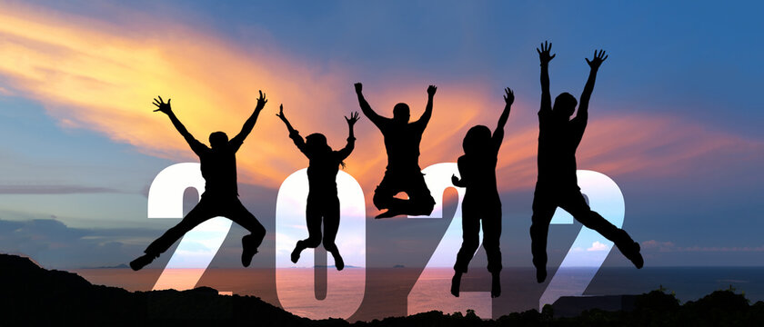 Silhouette happy business teamwork jumping congratulation and celebrate in Happy New year 2022 for change new life future.  Freedom lifestyle group people team jump as part of Number 2022 success