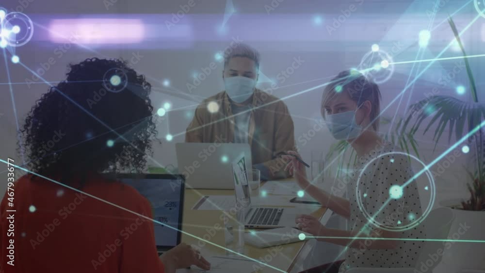Poster animation of glowing network over diverse colleagues in face masks using computers in office