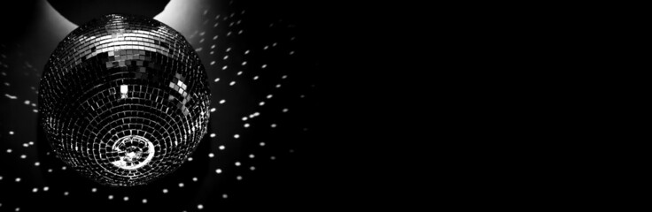 A shiny disco ball on black. Glare on a black background from a glass ball