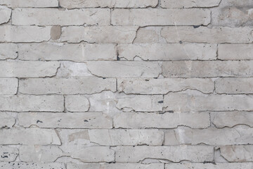 Gray concrete wall with brick pattern