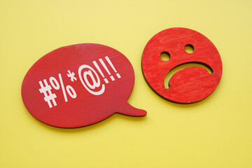 Hate speech or rudeness concept. Unhappy face and quote bubble. - obrazy, fototapety, plakaty