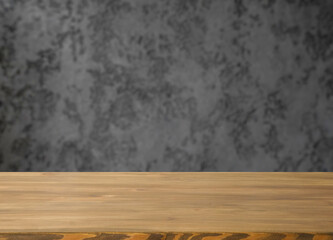 Empty table with free space and blurred grey wall.