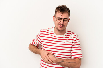 Young caucasian man isolated on white background having a liver pain, stomach ache.