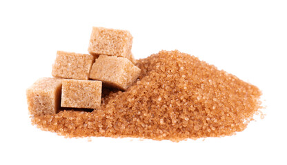 Brown sugar isolated on white background. Heap of cane sugar crystals and sugar cubes.