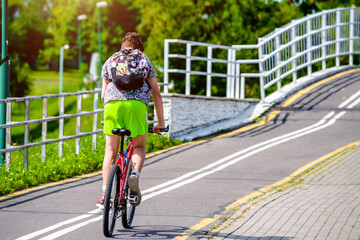 Fototapeta premium Cyclist ride on the bike path in the city Park 