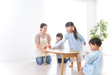 Fototapeta premium Children and teacher at kindergarten