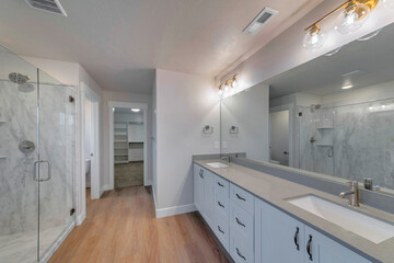 Luxurious bathroom interior with modern double vanity sinks and mirror