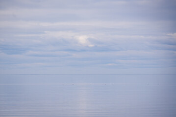 Selective focus photo. Peaceful and foggy sea.