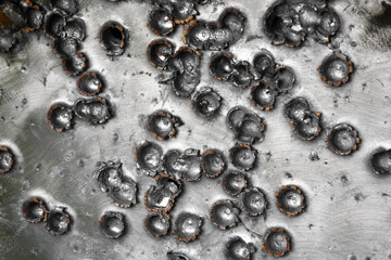 A metal target or gong for shooting sports firearms.