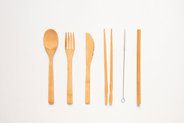 Eco friendly kitchen items . Zero waste and plastic free concept. Forks, knife and spoon in top view on white background. Disposable tableware. Natural products for recycle .