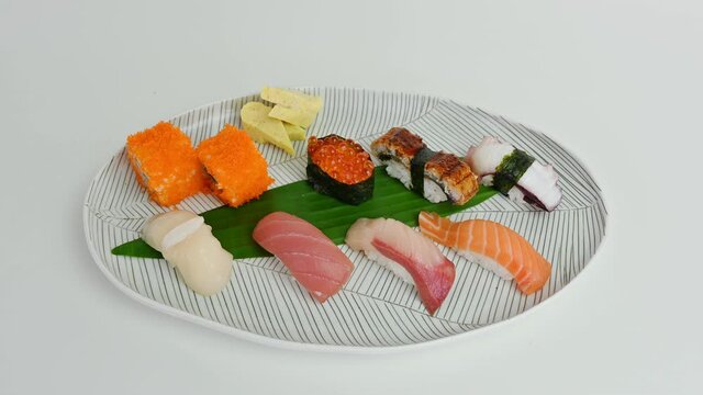 Variety of japanese nigiri sushi set of traditional food on white plate